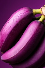 Wall Mural -  A tight shot of numerous bananas against a deep purple backdrop, adorned with water droplets atop