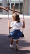© Rana - Girl swinging on a swing . High quality photo