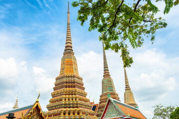 Stupas in Wat Pho Temple Complex in Bangkok city with traditional Buddhist architecture in Thailand, Asia. Temple of the Reclining Buddha. Popular tourist landmark