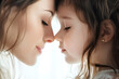 © Iriyalo - Tender moment of mother and daughter touching noses and smiling