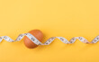© SKT Studio - Fresh egg and measuring tape on a table symbolize the idea of eating eggs for weight loss or health. The image highlights eggs as a nutritious choice for a balanced diet and fitness goals