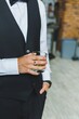 © DSMT - A man's hand in a classic suit with a glass of whiskey. Drinks for men.