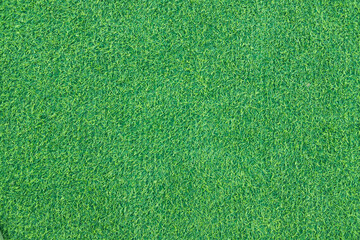 Close-up of lush green artificial grass, showcasing its detailed texture and vibrant color, perfect for outdoor landscaping and sports fields.