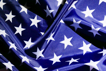 Blue fabric with white stars pattern fragment flag