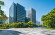 © thiquynh - Modern office buildings near the car park with empty space for text in Shenzhen, China. The area is surrounded by trees and has a clear blue sky