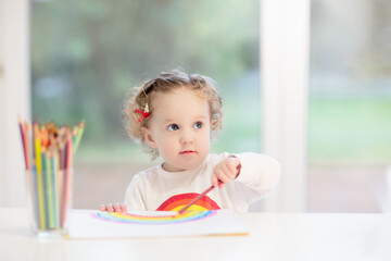 Wall Mural - Kids paint. Child painting. Little girl drawing.