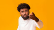 © Prostock-studio - Angry furious african american guy screaming and pointing at camera, yelling and reprimanding over orange background