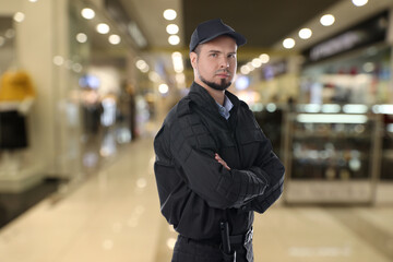 Wall Mural - Portrait of confident security guard in shopping mall