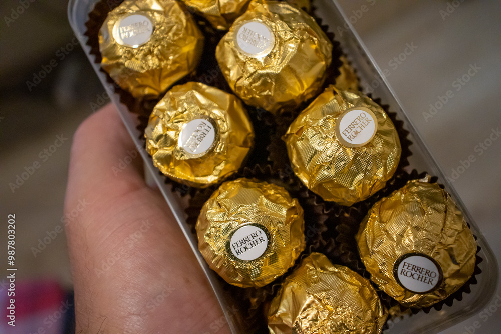 Warsaw, Poland - October 4, 2023: A hand holding a box of delicious ...