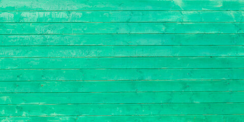 Green colored pastel wood background. Wooden abstract background.