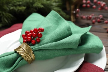 Christmas place setting with festive decor on table, closeup