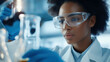 © Ayla - A female chemist or scientists conducts a scientific experiment in a laboratory for research and develop to medicine, future health care innovation.