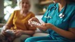 © somneuk - A close-up of a home care nurse assisting a patient with daily tasks, such as medication management and wound care.