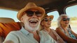 © Валерий Тодаренко - A group of elderly friends taking a road trip together, laughing and enjoying the journey