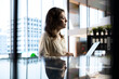 © DC Studio - Female CEO leader working on financial planning and budget allocation, ensuring the company resources are used effectively to achieve maximum profit and long term objectives in office.