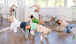 © JackF - Group of active children dancers having break dance training at dance studio