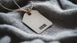 © lemoncraft - Blank Tag on Gray Knit Fabric