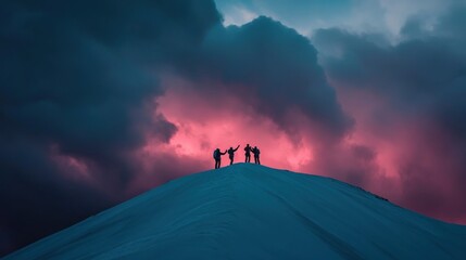 Wall Mural - Silhouetted figures atop a snowy peak against a dramatic, colorful sky.