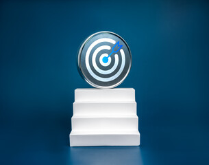 Big round metal target icon on top of modern geometric white staircase as bar graph chart steps on blue background. Business goal, growth process, profit, investment, economic improvement concepts.