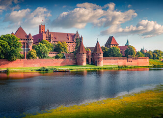 Wall Mural - breathtaking summer cityscape of malbork town on the nogat river, pomeranian voivodeship, poland, eu