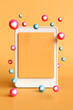 © Midnight Studio - Vertical image of Blank page copy space on orange background with love icon and likes to float around. Concepts of public relations, marketing, and social media.