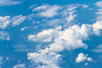 Wall Mural - Blue sky with clouds in the sky. Sky clouds background. White cloudy Heaven with soft sun light. Clouds on pastel blue sky background.