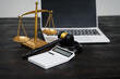 © NanSan - A lawyer's desk in an office,with legal documents, computers, and hammers placed neatly.The setting is organized for legal consulting services, contract reviews,will drafting,document certification