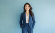 © Surachetsh - Ambitious and assertive Asian businesswoman in a blue suit, displaying a focused and determined expression. She projects confidence and authority, ready to take on leadership roles.