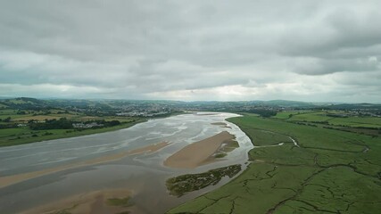 Wall Mural - Drone soaring high over the River Taw Estuary towards Barnstaple town in North Devon, England, UK