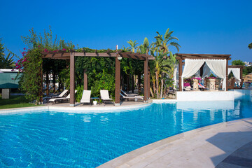 Canvas Print - Swimming pool. Summer vacation at poolside. swimming pool in resort hotel for vacation leisure