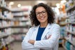 © Panuwat - Portrait middle-aged woman curly hair glasses standing pharmacy Middle age female latin