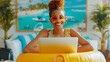 © SS Digital - Funny happy smiling african american woman standing at the desk on workplace at office in a beach rubber ring with suitcase and booking tickets for summer vacation online via laptop