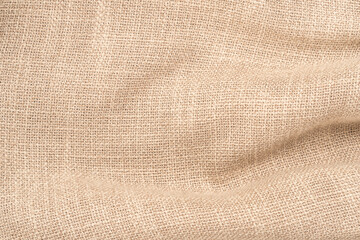 Wall Mural - jute hessian sackcloth woven burlap texture background in sepia cream old aged brown color