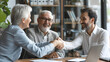 © SS Digital - Senior couple, happy old people and realtor handshake deal in office. Helping clients buy, rent home, apartment, male real estate agent assisting buyers in marketing, display real