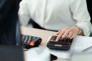 Wall Mural - Asian female audit accountant calculating invoice and tax, Financial concept.