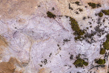 Detailed photo of granite stone surface. Close up texture of natural stone.