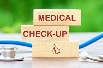 MEDICAL CHECK-UP words written a conceptual phrase on wooden blocks