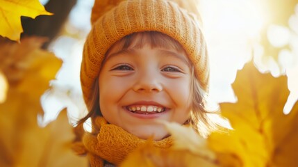 Wall Mural - A joyful child smiling amidst vibrant autumn leaves in a sunlit park during a crisp fall afternoon.