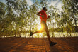 © sutadimages - Runner trail running fitness on nature landscape.athlete's feet wearing sports shoes for trail running in the forest