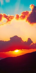 Wall Mural - Orange and Blue Sunset over Mountain Silhouette