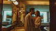 © liliyabatyrova - A man and woman are kissing in a bathroom. The man is wearing a robe and the woman is wearing a robe as well