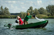© Westend61 - Mother and daughter removing water from leaking boat in lake