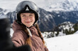 © Westend61 - Happy teenage girl taking selfie in front of mountains