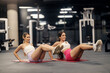 © Dusan Petkovic - Two fit trendy gym friends practicing on exercise mat in at health club.