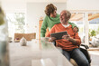 © Westend61 - Senior woman with husband on wheelchair using tablet PC at home