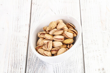 Wall Mural - Salted tasty pistachio nuts heap