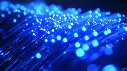 Wall Mural - close-up of glowing blue fiber optic cables, symbolizing fast data transmission and advanced communi
