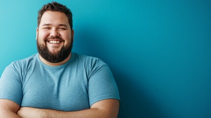 middle age man plus size smiling on blue shirt