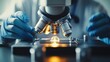 © Jojo* - Close-up of a Microscope with Gloved Hands