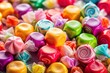 © kansak01 - Brightly colored taffy candy assortment set on a vivid background, ideal for showcasing delicious treats and desserts